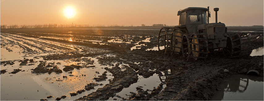 tractor in muddy field